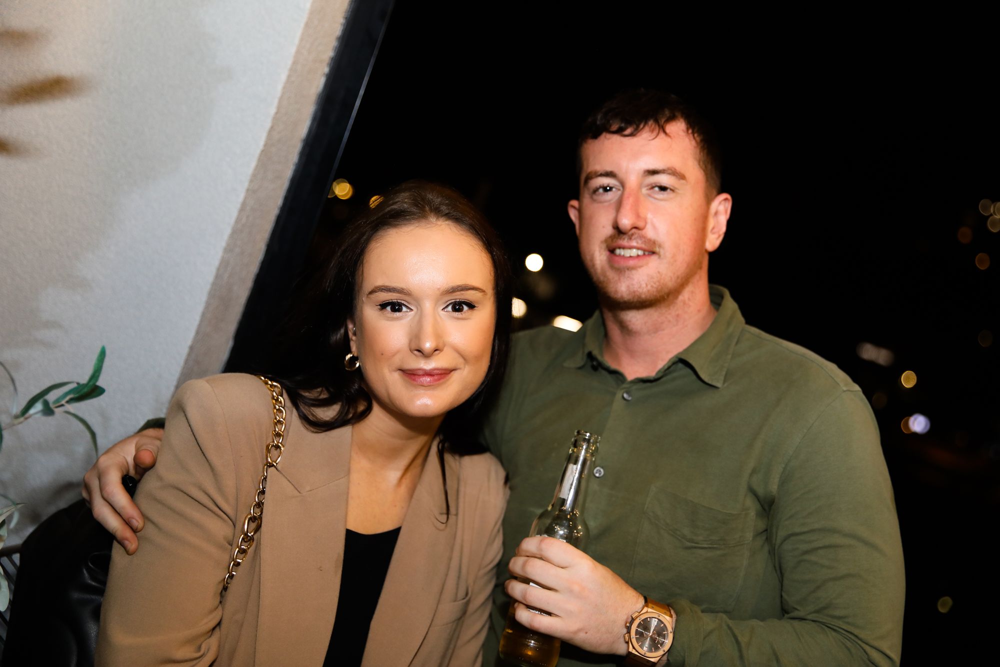 A couple both smiling at the camera