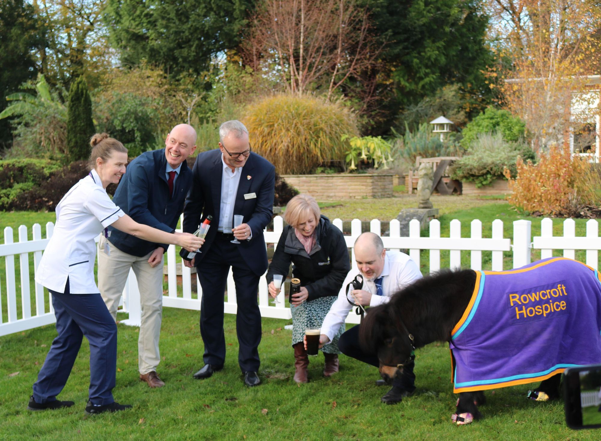 Rowcroft Hospice CEO Mark Hawkins leads the celebrations at VIP Patrick's new pen