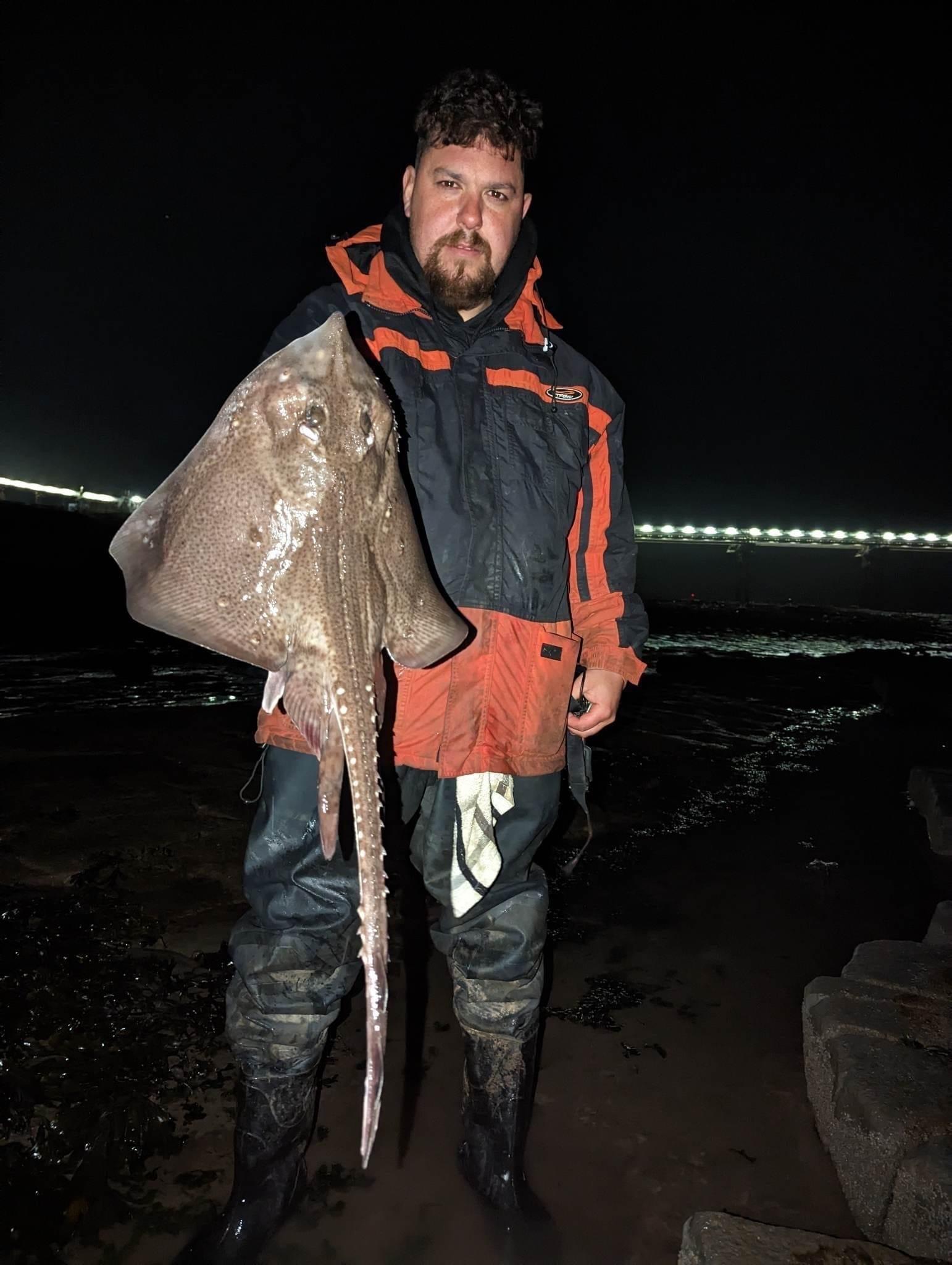 Saleem Ali with a thornback ray.