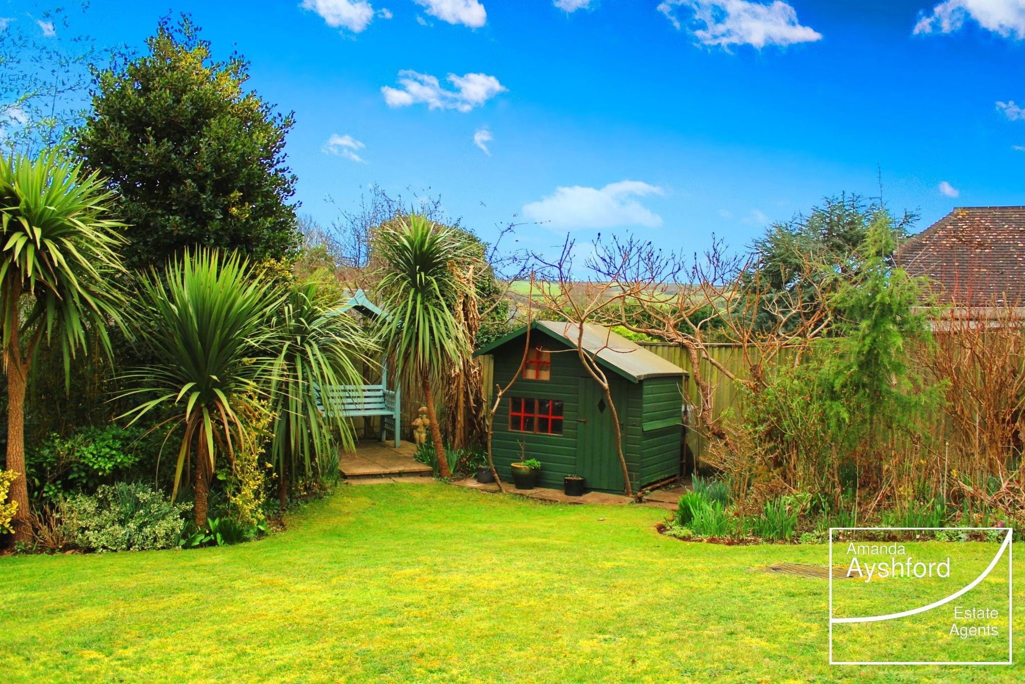 The rear garden features a small summerhouse. Credit: Amanda Ayshford estate agents
