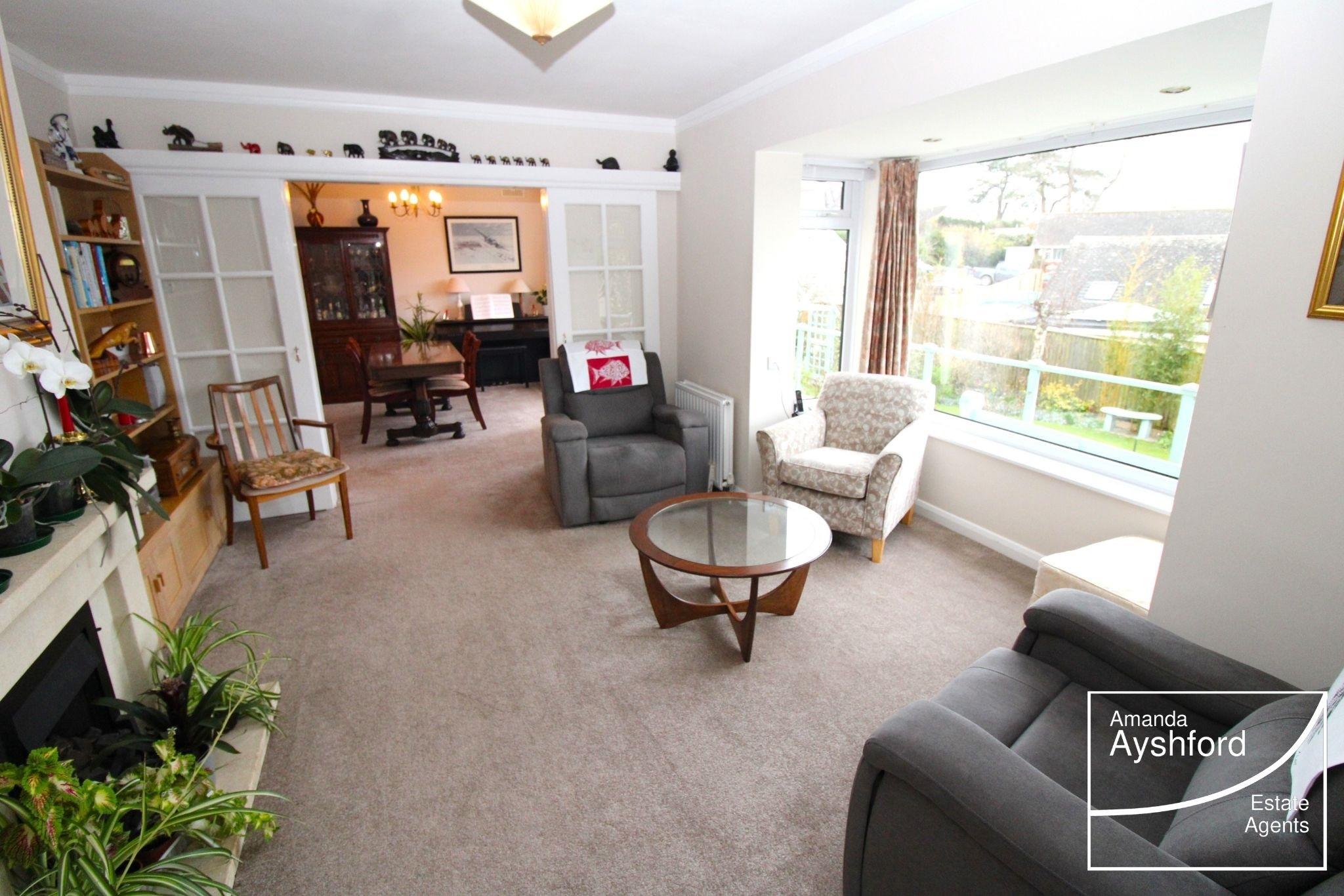 The living room and dining rooms enjoy superb views across the gardens. Credit: AManda Ayshford estate agents