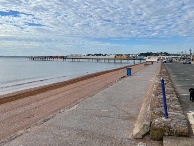 Paignton beach in the early morning after the tractor and rake removed seaweed